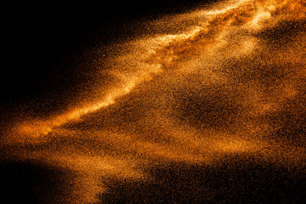 istock Brown colored sand splash.Dry river sand explosion isolated on black background. Abstract sand cloud. 1211792143