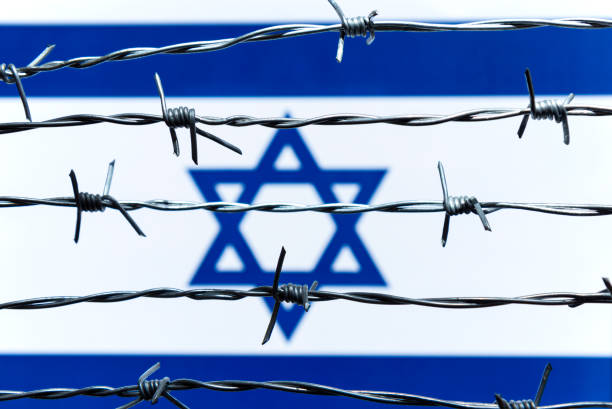 istock Israeli Flag and Barbed Wire 1211792267
