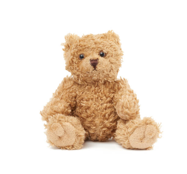 istock cute little brown teddy bear, toy is sitting on a white background 1211793600