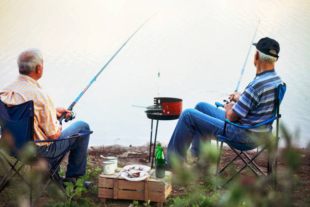istock Two men relaxing and fishing 1211797226
