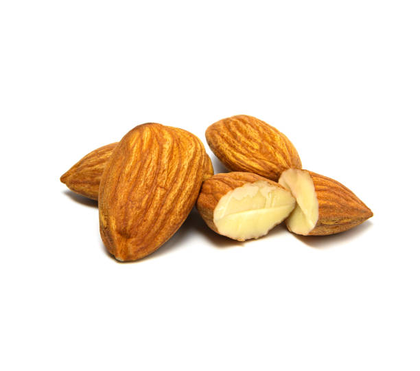 istock Closeup almonds nut cracked isolated on white background. 1211797413