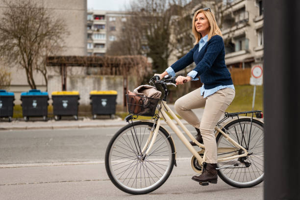 istock Woman riding a bicycle in urban area 1211797572