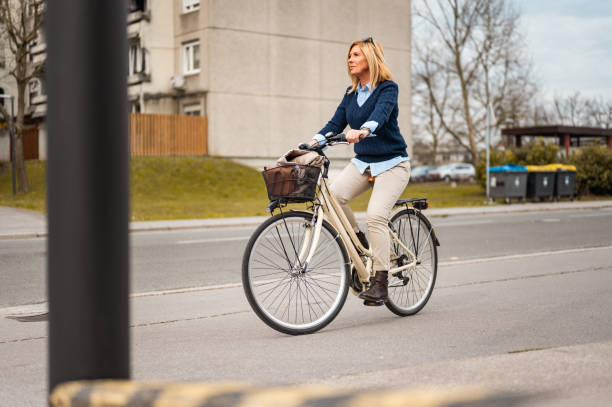 istock Woman riding a bicycle in urban area 1211797610