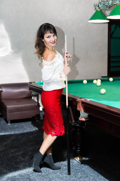 istock Brunette girl near the pool table, 1211798473