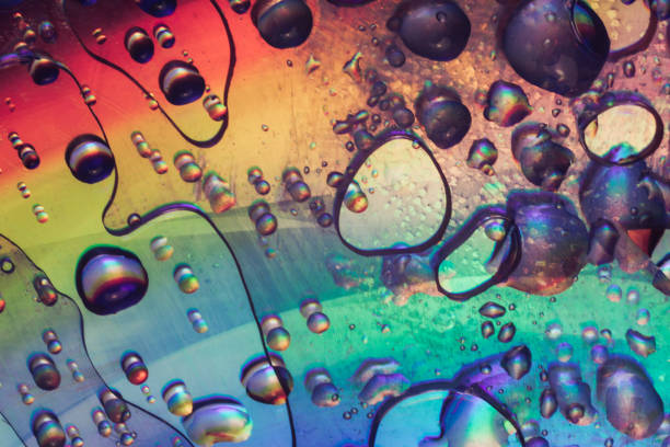 istock Beautiful abstraction rainbow color light water drop of holographic effect. Background pattern for design. Macro photography view. 1211799086