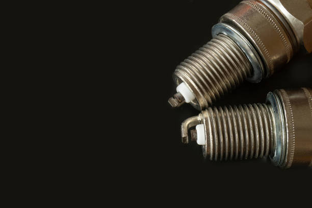 istock Car spark plug on dark background 1211799769