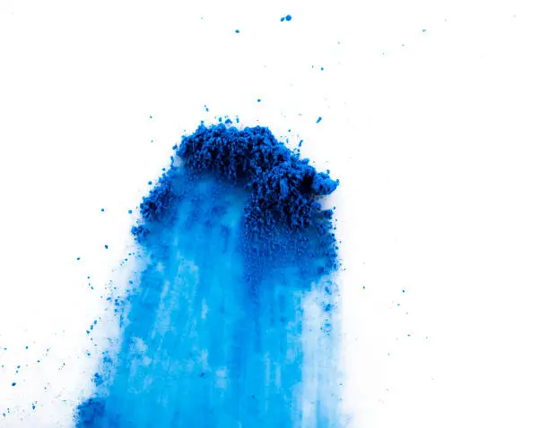 blue pigment scattered on white background Stroke with pigment. Paint material