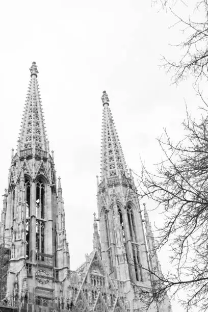 Votive Church (Votivkirche) a neo-Gothic style church located in Wien,Vienna, Austria. Europe. Tower view. Black and white photo.