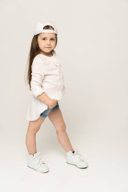 istock Cute girl 5-6 year old posing in studio. 1211805546