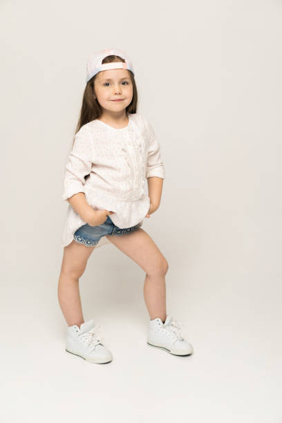 istock Cute girl 5-6 year old posing in studio. 1211805548