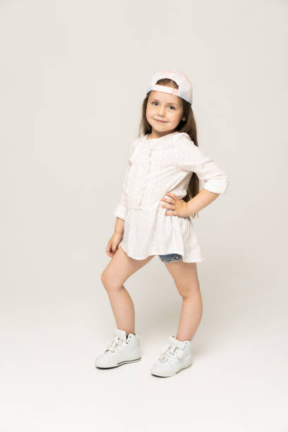 istock Cute girl 5-6 year old posing in studio. 1211805550