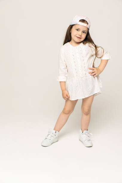 istock Cute girl 5-6 year old posing in studio. 1211805554