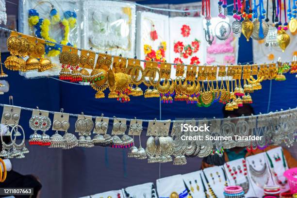 A Collection Of Colorful Indian Earrings Stock Photo - Download Image Now - Artificial, Jewelry, Store