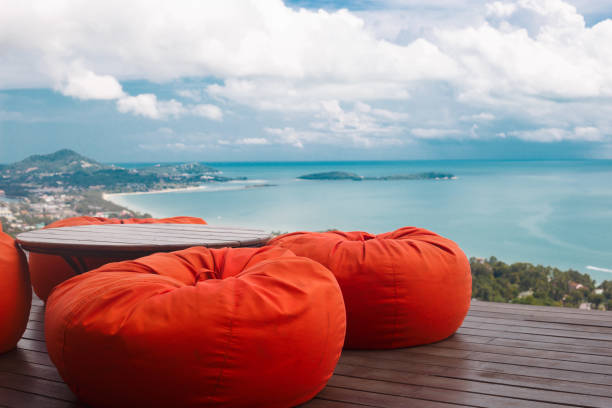 comfortable ottomans on top of a mountain with ocean views