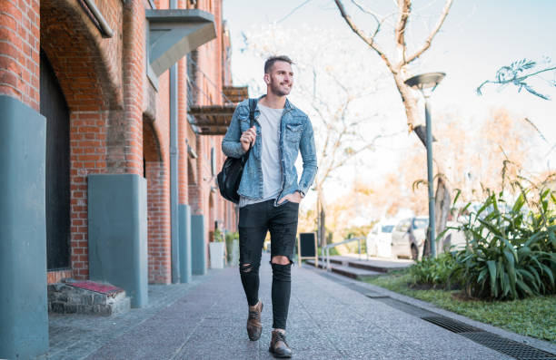 istock Man walking on the street. 1211812315