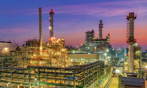 Oil Refinery Oil Refinery at twilight greenpeace stock pictures, royalty-free photos & images