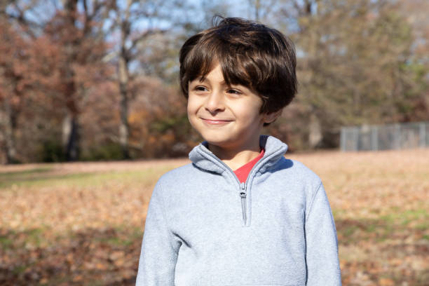 istock Little Boy Outside in Autumn 1211813397