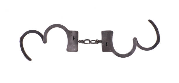 istock steel handcuffs isolated on a white background 1211814998