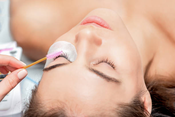 istock Eyelash extension with brush. 1211815173