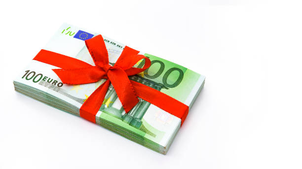 istock Bundle of money with red ribbon 1211815256
