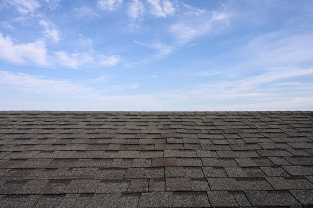 istock Dark roof tiles with blue sky 1211815843