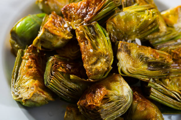 istock Artichokes fried in oil 1211816091