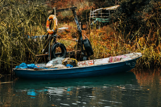 fishing boat on the lake shore. - rowboat nautical vessel small motorboat imagens e fotografias de stock