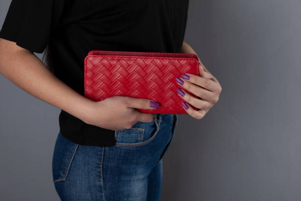 istock woman hand bag 1211816261