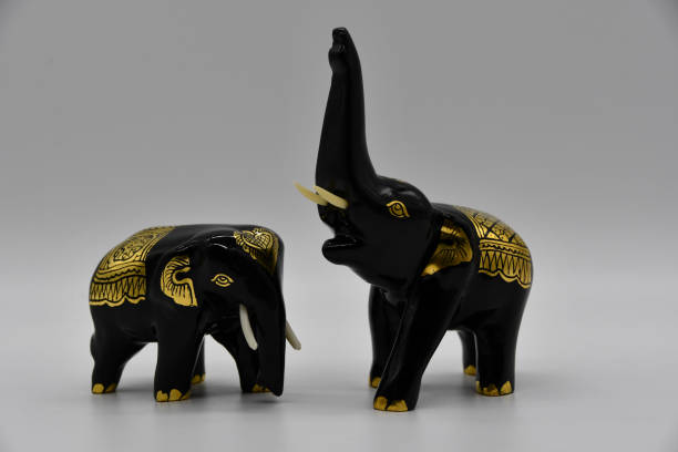 istock Two black and gold elephants from Thailand as a souvenir 1211816690