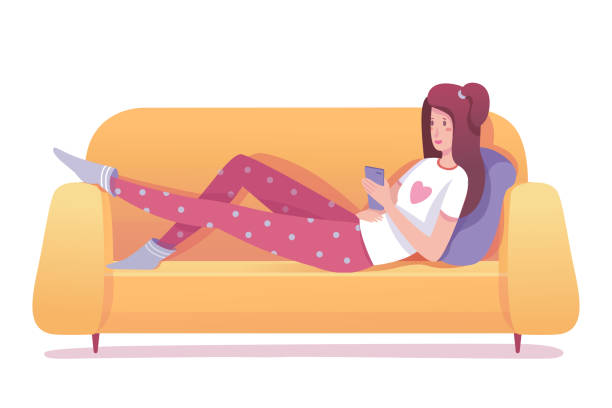 Girl networking lying on sofa isolated on white Teenager girl networking lying on sofa isolated on white. Young woman wearing pajamas chatting social media network, reading online book, viewing feed news. Smartphone zombie or digital addict vector pajamas illustrations stock illustrations