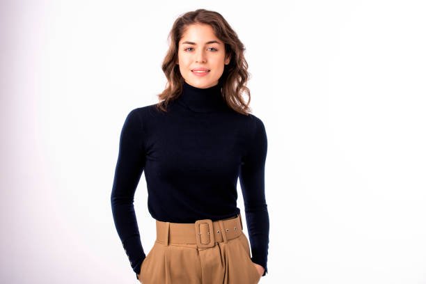 istock Cheerful and attractive young woman standing at isolated white background 1211821771