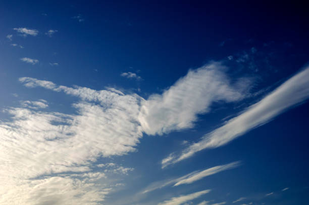 istock White cirrus clouds in the blue sky. 1211822210