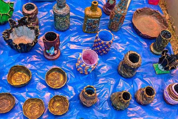 istock Vase, pen stand and bowl are made from waste component, displayed for sale. 1211823705