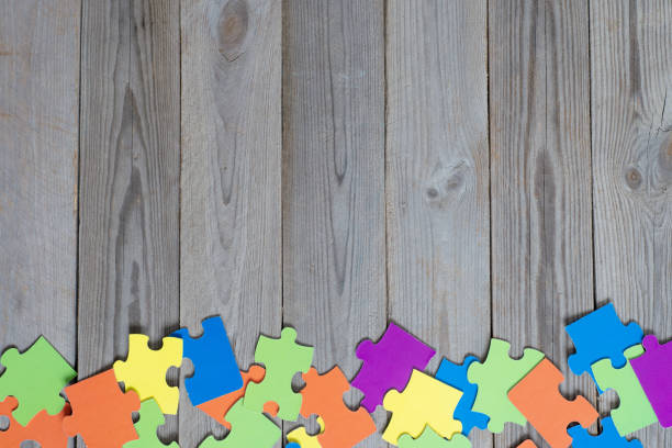 istock colored puzzle on wooden boards team business concept 1211824909