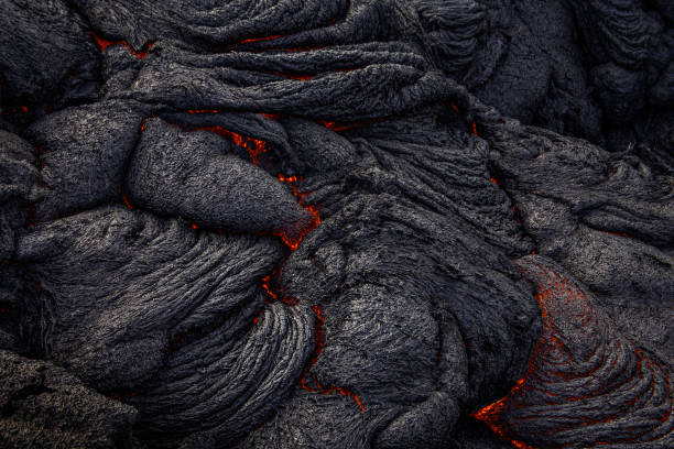 Molten Lava, Big Island, Hawaii Glowing magma flows between the cracks of lava rock and slowly moves forward on the Big Island, Hawaii kīlauea volcano photos stock pictures, royalty-free photos & images
