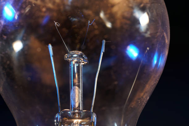 istock Old lightbulbs in the studio on black background photographed with flash light 1211830154