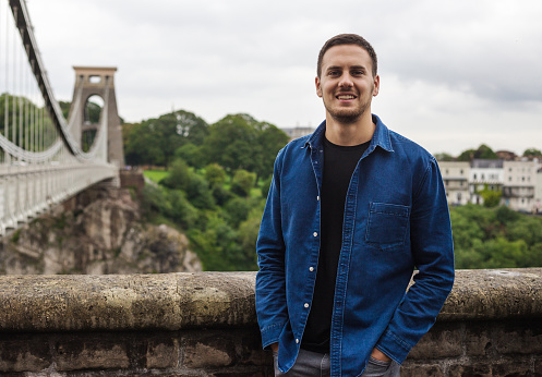 Male tourist visiting Clifton Suspension Bridge in Bristol