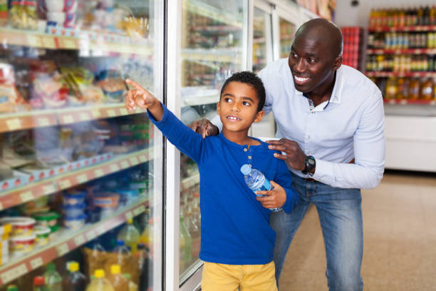 istock African American man with his son making purchases 1211831087