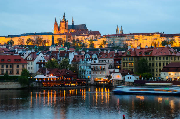 istock Old Town architecture and  Vltava river at night in Prague, Czech Republic. 1211831796