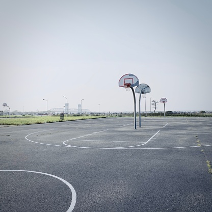 basketball court in the out of town in the end of summer.