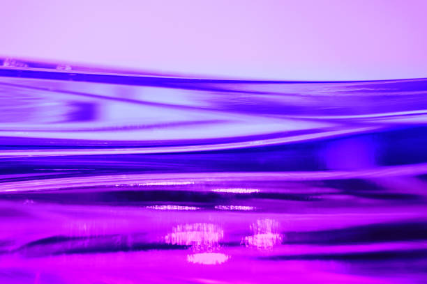 istock Abstract blurred neon pink and purple wavy background 1211834080