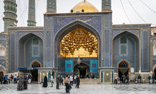 Shrine of Fatima Masumeh, Qom, Iran - May 2019: Visitors and worshippers inside of Shrine of Fatima Masumeh in Qom, which is considered by Shia Muslims to be the second most sacred city in Iran.