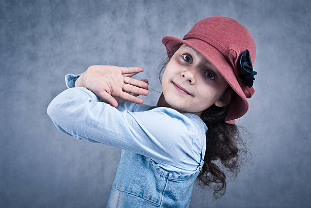 little girl in red hat stock photo