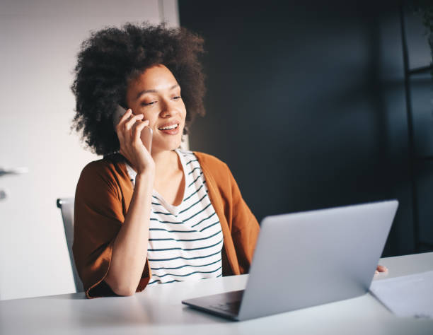 istock Young businesswoman using smartphone in he office. 1211837110