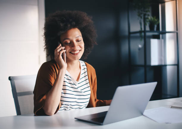 istock Beuatiful businesswoman talking on smartphone in modern office. 1211837137
