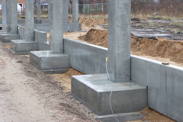 istock some Concrete columns for a factory building are erected on a large construction site 1211842218