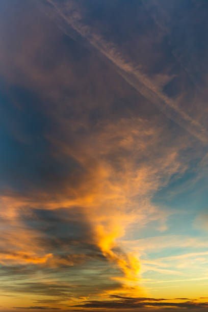 istock Fantastic clouds at sunrise, vertical panorama 1211843707
