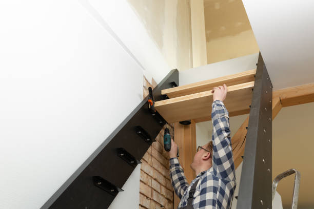 istock Home improvement handyman building staircase in a natural light 1211849756