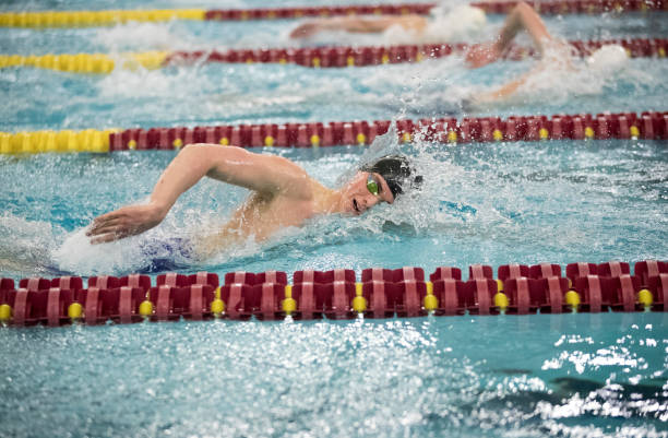 istock Young Man Swimming Freestyle 1211849932