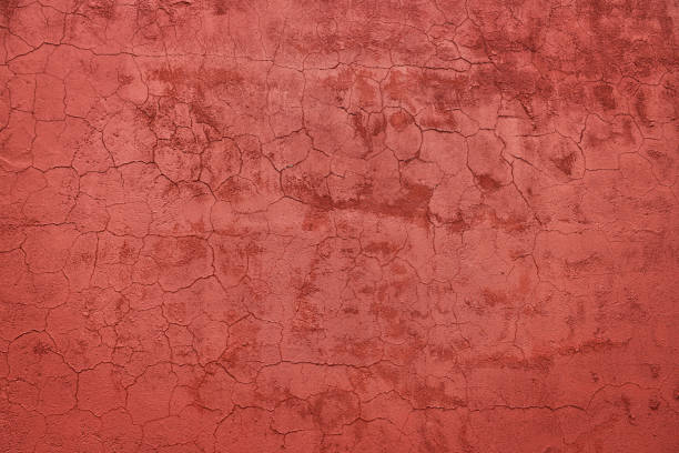 fondo de un exterior recubierto y pintado de estuco rojo, molde áspero de cemento y textura de pared de hormigón - retro revival old fashioned old architecture fotografías e imágenes de stock